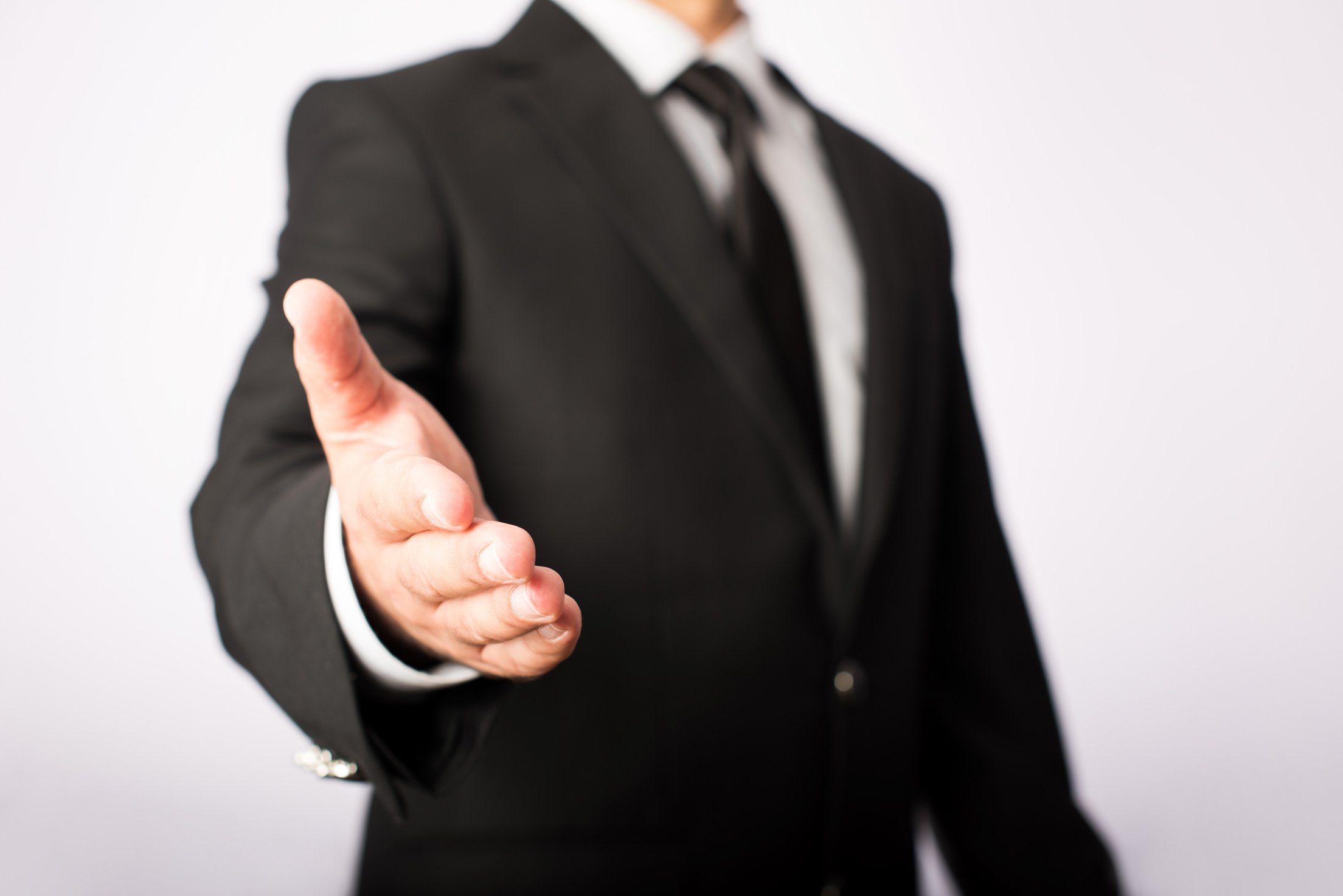 Businessman Extending Hand To Shake